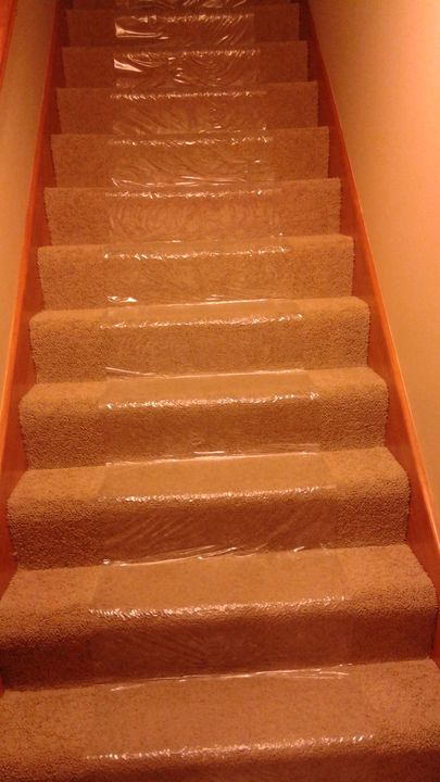Staircase covered with protective film (Full Service Moving) by Moving Pros CLE