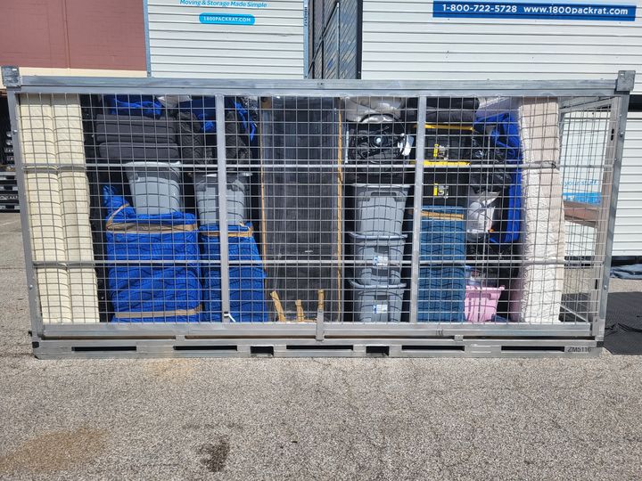 Wire storage cage loaded with belongings (Loading Services) by Moving Pros CLE